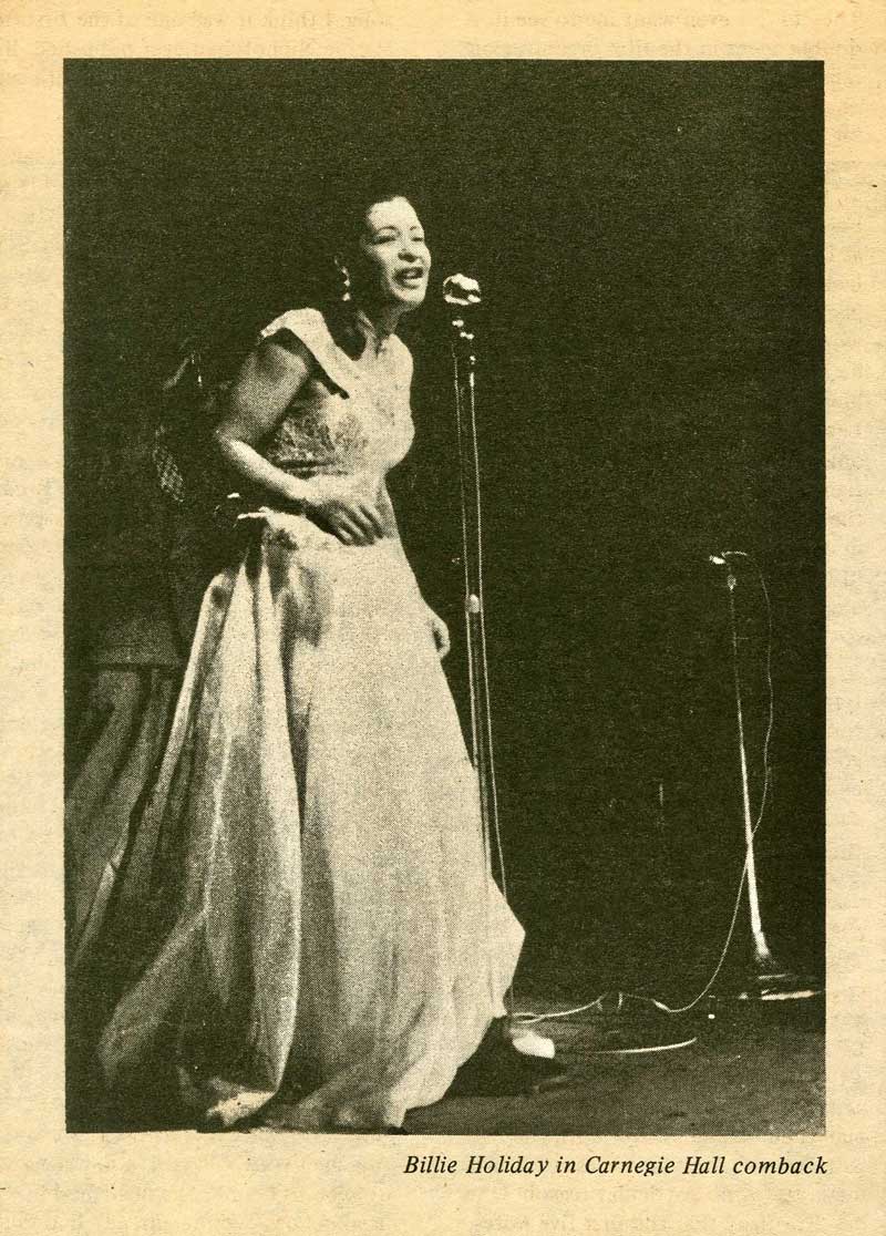 A person in white dress at a microphone